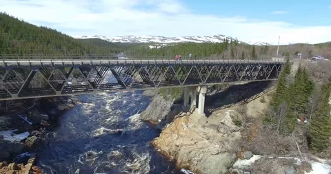 HIGH BRIDGE OVER WILD RIVER IN LABRADOR BY DRONE Stock Footage 90758921