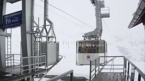 High capacity cable car which starts at the departure station and head toward Stock Footage 68944377
