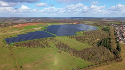 High-capacity photovoltaic infrastructure integrated into British farmland for Stock Footage 340897635