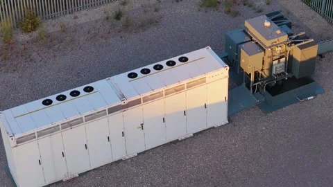 High capacity Tesla utility scale battery units placed on a gravel ground Stock Footage 346423037