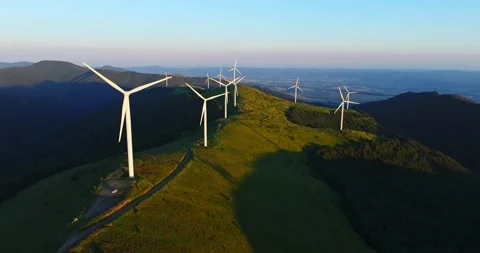 High Capacity Wind Catcher Farm On High Mountain Ridge Sunrise Aerial Orbit Stock Footage 300485863