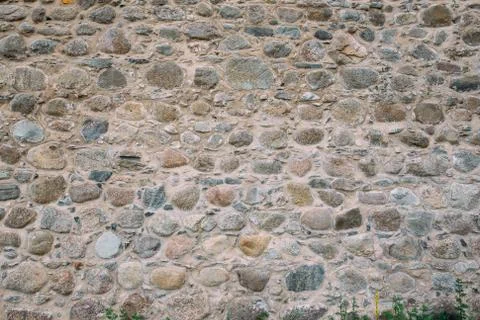 High castle wall made of large stone Stock Photos