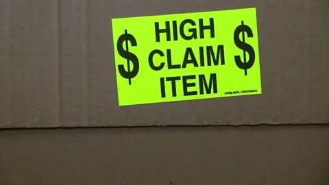 High Claim Item Reflective Sticker On Cardboard Box Shipping Package. Stock Footage 267280304