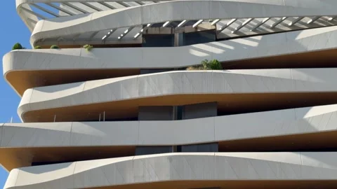 High class modern architectural design featuring undulating penthouses in Stock Footage 347856985