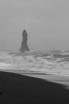High cliff on Iceland beach monochrome landscape photo Stock Photos
