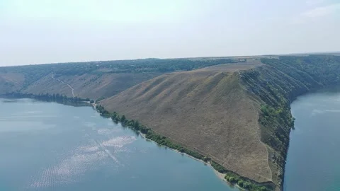 High Cliffs Above the Mirror Surface Bakota Ukraine. Stock Footage 313953950