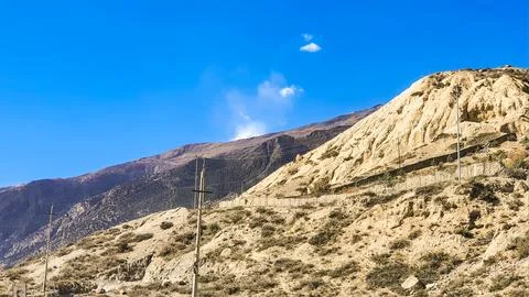 High cliffs above the road. Stock Photos