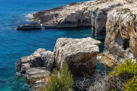 High Cliffs and Golumbera Cave at Velika Kolumbarica Beach on Cape Kamenjak Stock Photos