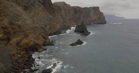 High cliffs on coast of Madeira island at Ponta De Sao Stock Footage 246334204