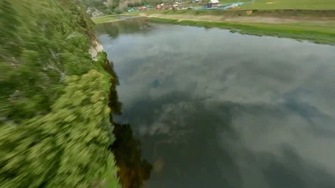 High cliffs covered with vegetation, winding river in the valley below, view Stock Footage 156389036