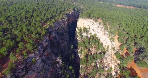 High Cliffs Inside the Pine Forest 4k Drone Shot at Sunset Stock Footage 147090055