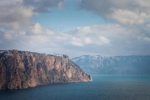 High cliffs over the sea under a blue sky with clouds. Fiolent. Stock Photos