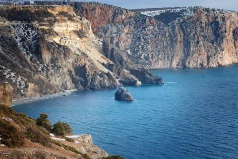 High cliffs over the sea under a blue sky with clouds. Fiolent. Stock Photos