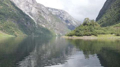 High cliffs reflected on the surface of the sea in fjords. Stock Footage 247866354