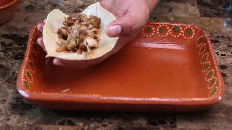 High close up view of taquero making 3 carnitas tacos. Mexican food Stock Footage 279539673