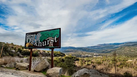High Clouds and Welcome to Oakhurst Sigh Time Lapse Stock Footage 284430071