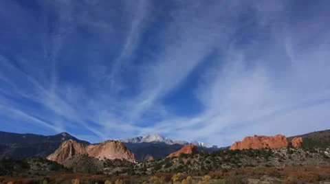 High Clouds Stream Over Pikes Peak Mountain And The Garden Of The Gods Timelapse Stock Footage