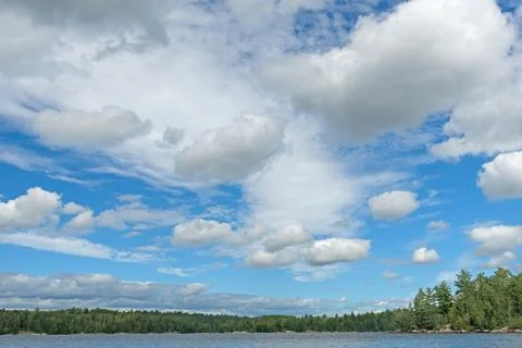 High Clouds of Summer Over  North Woods Lake 스톡 사진