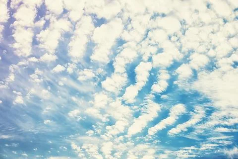 High clouds in the summer sky. Sky background. Meteorological observations .. Stock Photos