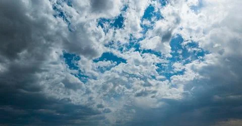 High clouds in the summer sky. Sky background. Meteorological observations .. Stock Photos