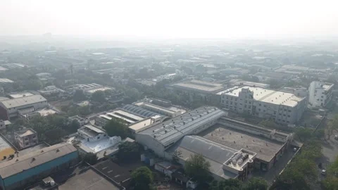 A high concentration of flat-roofed factories, warehouses with solar panels Stock Footage 333539191