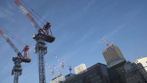 High construction cranes against the blue sky. Tokyo, Minato. 스톡 동영상 92003990