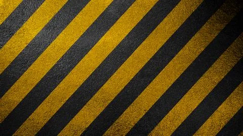 A high-contrast background featuring diagonal yellow and black safety strip.. Stock Photos