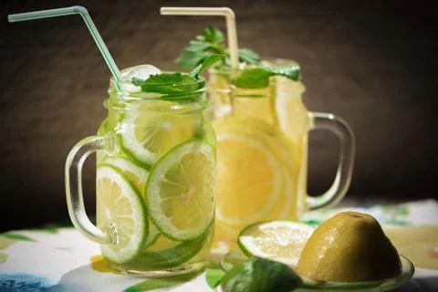 High contrast closeup vertical view of homemade lemonade with ice in mason ja Stock Photos