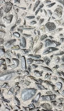 High contrast graphic texture of dark grey and black irregular cobblestones.. Stockfoto's