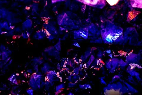 High-contrast image of dark violet-blue crystalline formations resembling Stock Photos