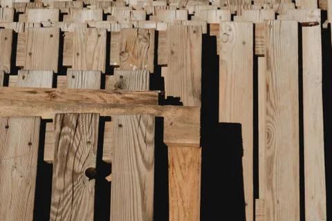 High contrast image of a stack of used wooden euro pallets Stock Photos