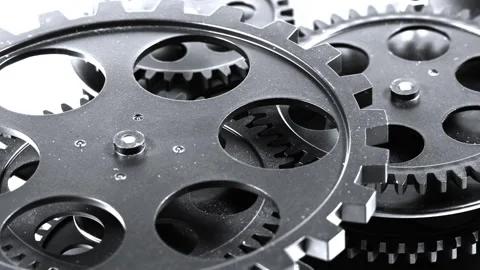 High Contrast Macro Close-Up of Interlocking Dark Metal Gears Stock Footage 340938270