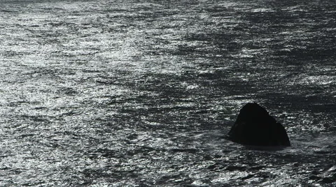 HIGH CONTRAST OCEAN WAVES WITH SOLO ROCK AND NEGATIVE SPACE Stock Footage 59070004