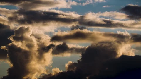 High-Contrast Storm Clouds Time-Lapse. Golden Sunlight Illuminating Dark Cumulus Stock Footage 318296288