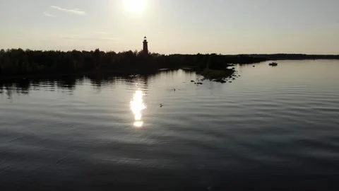 High contrast view of small island at big calm lake, aerial camera fly low Stock Footage 169696582