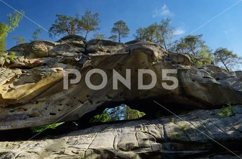High crag in forest Stock Photos