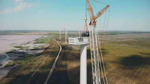 High crane installs large electric rotor into generator Stock Footage 157903006