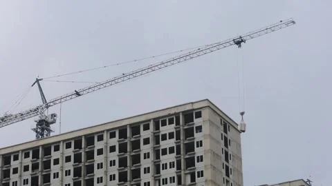 High crane working on drop Modern elevator moving down in skyscraper Video stock 244443452