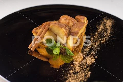 High cuisine, baked apple with cinnamon Stock Photos