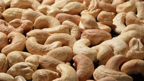 High Definition Close-up of Rotating Roasted Cashews Tilted View. 스톡 동영상 332837941