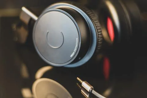 High definition earphone with nice reflection in focus. Stock Photos