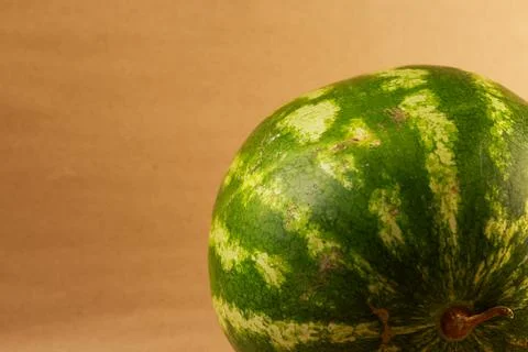 A high-definition studio side-view photograph of a freshly cut watermelon Stock Photos