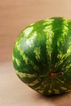 A high-definition studio side-view photograph of a freshly cut watermelon Stock Photos