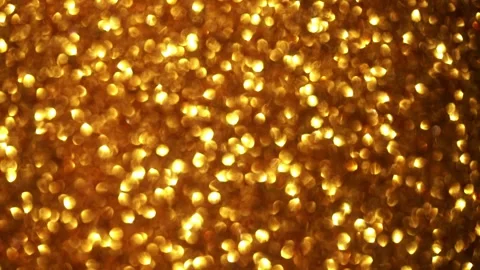 High-Density Golden Copper Glitter Shimmering on Dark Surface Видео 332073939