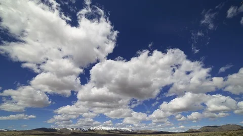 High Desert Landscape Time Lapse Clouds with Snow on Distant Mountains. Stock Footage 105490315