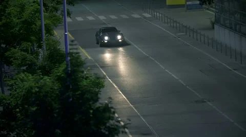 High diagonal shot of blue Corrvete at the night drive Vídeos de archivo 33004055