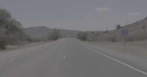 High Dolly Shot of an Empty Desert Road Through Rural Texas Stock Footage 246460402