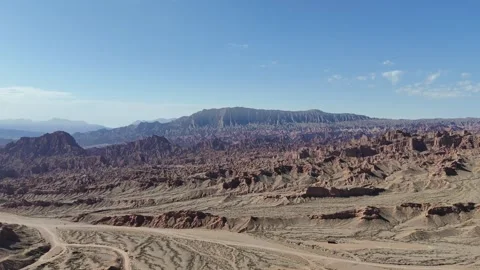 High drone dry canyon road and textured mountain landscape in Xinjiang China Stock Footage 337694513