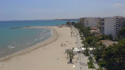 High drone flight with ocean view along the promenade of a beach resort Stock-Footage 150339756