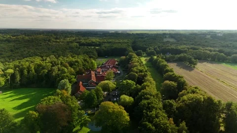 High Drone Flight Over Building with Orange Roof in the Netherlands Video stock 317847660